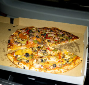Pizza in the back of the truck for the Gloworm Lights production crew after wrapping the night shoot in the Redwoods, Rotorua.